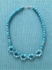 Collier 44 cm perles naturelles de calcédoine bleue et hématite dorée
