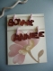 Carte de voeux 3d bonne année en simili cuir tenu par des petites pinces à linge rose 