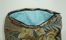 Trousse en jacquard motif tapisserie verdure 