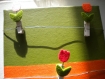 Pêle-mêle sur châssis entoilé en vert et orange pinces tulipes 