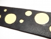 Manchette en cuir veritable, "meteorite" ,noir et jaune pale ,graphique ,cercle 